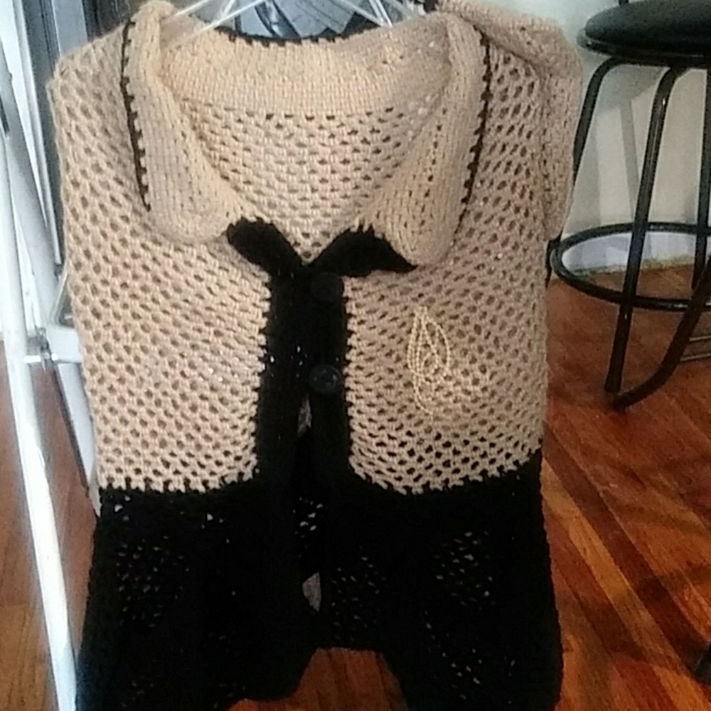 Button front cape shawl with opening for arms. And